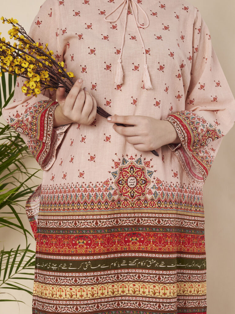 Woman wearing Khushnaseeb Urdu poetry kurti and pyjama set by AH Clothing, full-length